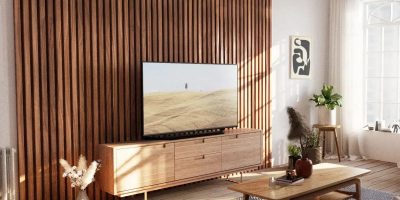 midcentury-modern-living-room-with-wood-slat-tv-accent-wall-sunny.webp